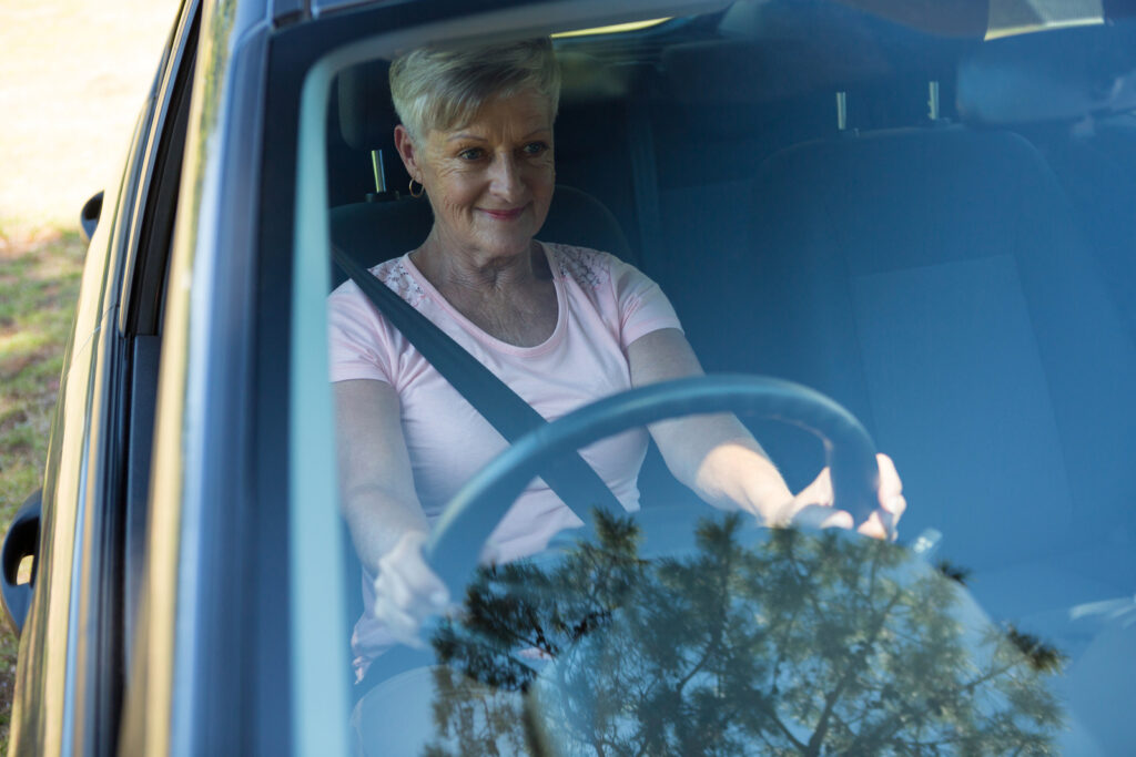 old lady on her car